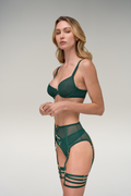 Gemm and Garnet — Woman wearing a green bikini set on a plain background
